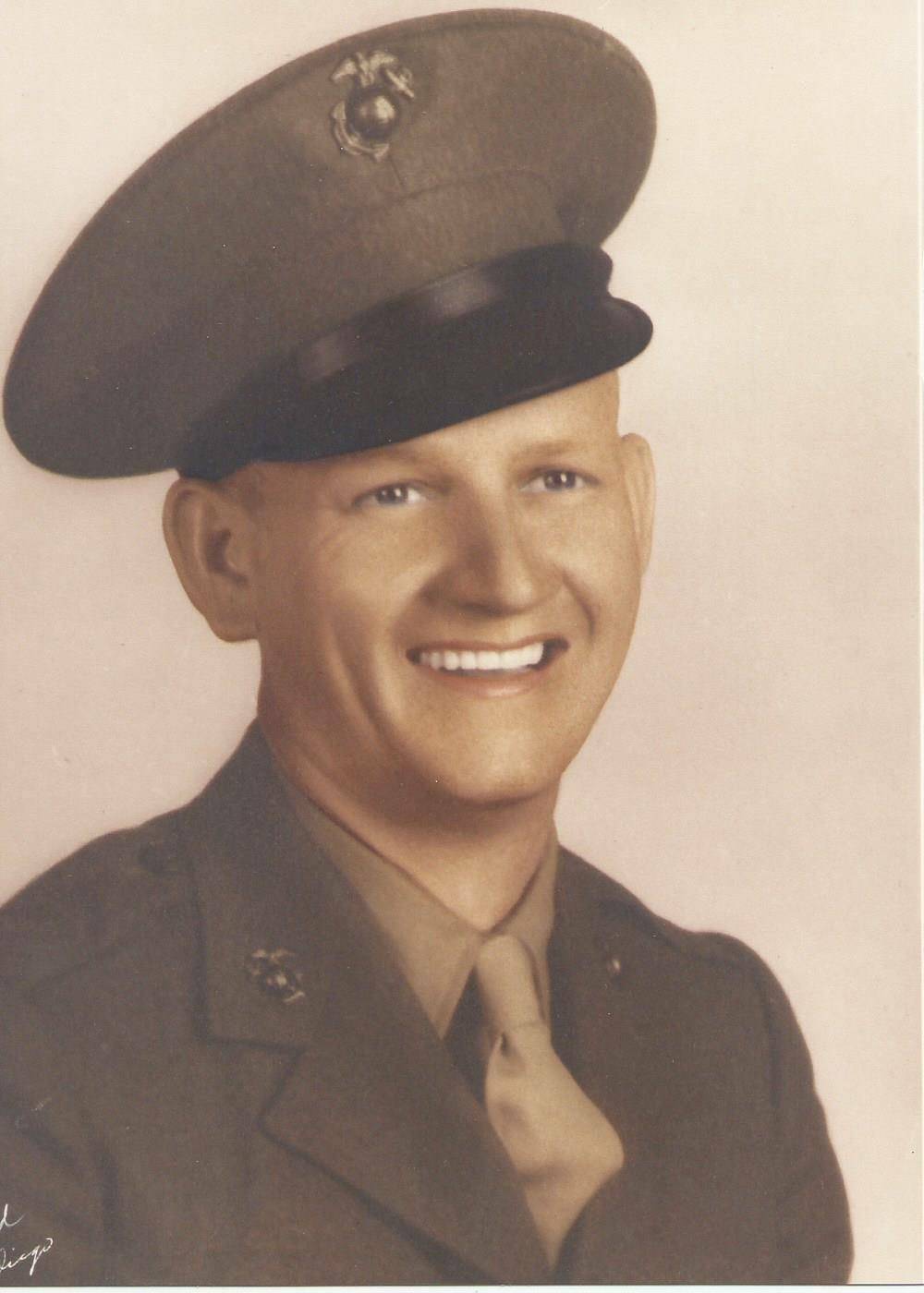 A soldier and the author's papaw in a Marine uniform from WWII